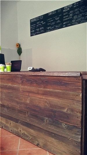 Hand- made wooden counter at Raw Nest in Krakow