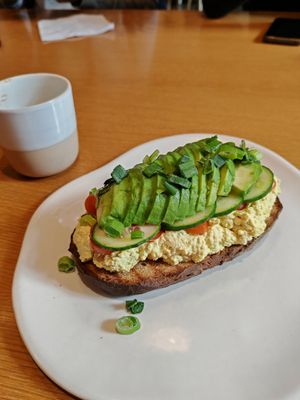 Avo and scrambled tofu on toast at Raw Nest in Krakow
