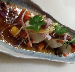 silk tofu with tomato/ginger relish , shiitakes , cilantro, tamari & spicy chili oil . at Zen Cuisine in Durango