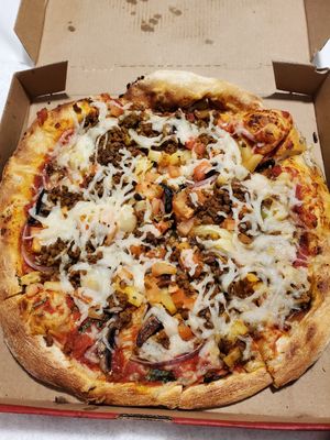 Red sauce, veggies on the bottom, vegan sausage crumble and vegan cheese 👌 at Mod Pizza - 6th Ave in Seattle