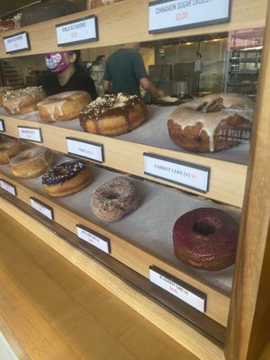 Banana chai, elote, carrot cake, guava,   at Nomad Donuts in San Diego