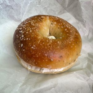 rosemary bagel with (vegan) guava jam cream cheese (and most importantly — a vegan bagel with a good amount of cream cheese!)  at Nomad Donuts in San Diego