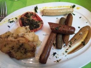 Vegan sausages with potatoes and provence tomatoes  at Espiritu Libre in Valencia