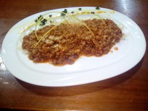 Bolognese pasta with vegetable meat and vegan parmesano. at Espiritu Libre in Valencia