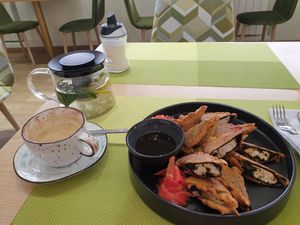 The appetizer fish (tofu) and ginger tea small at Veggie House in Astana