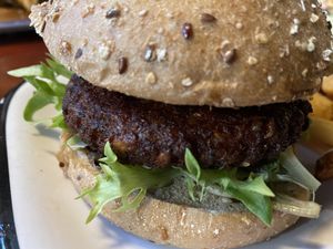My Sunshine burger-  sweet potato, kale & wild-rice patty, avocado, baby kale, organic tomato, spicy green goddess  at Bareburger - Hell's Kitchen in New York City