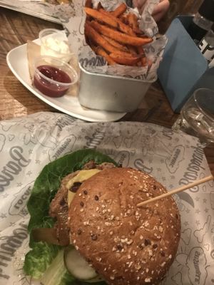 Impossible burger with vegan cheese, sweet potato fries with vegan mayo at Bareburger - Hell's Kitchen in New York City
