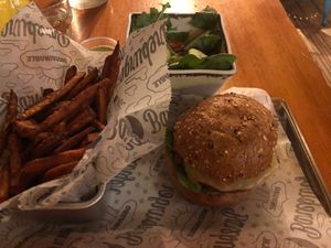 Sweet potato fries, side salad, Beyond burger on multigrain bun at Bareburger - Hell's Kitchen in New York City