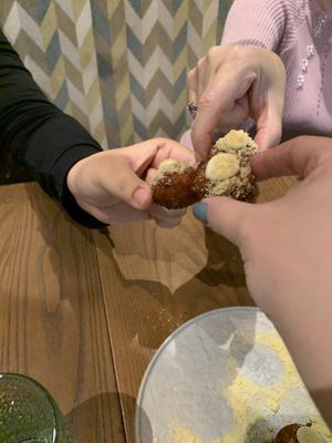 Cheers with cauliflower tots  at PLANTA - Yorkville in Toronto