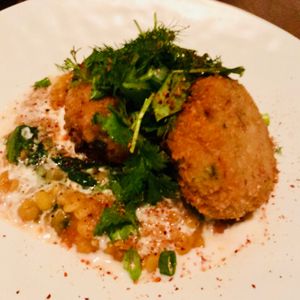 Crab cakes with chana dal at PLANTA - Yorkville in Toronto