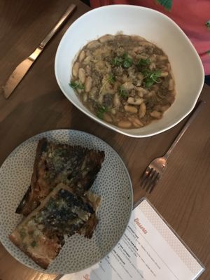 Mushroom bolognese and lemony garlic bread at PLANTA - Yorkville in Toronto
