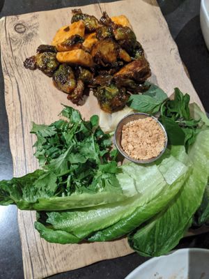 Tofu and Brussel Sprout Gochujang Lettuce Wraps at PLANTA - Yorkville in Toronto