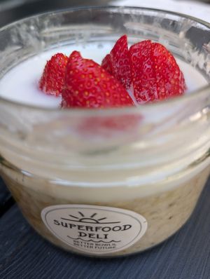 Hot porridge with strawberries at Superfood Deli - Mariahilfer in Vienna
