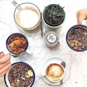 Breakfast with porridge bowls, coffee with tasty rice-coconut milk, and everything organic😄 at Superfood Deli - Mariahilfer in Vienna