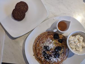Oat milk protein pancakes and side of vegan sausage at Silver Diner in Frederick