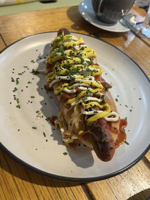 Hot dog - too much sauce in my opinion   at Wombat Cafe & Store in Dromana
