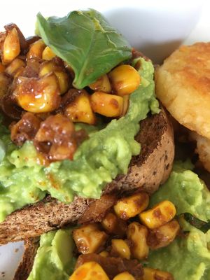 Smashed avo, chipotle corn on gf bread with hashed browns and scrambled tofu.  at Wombat Cafe & Store in Dromana