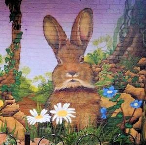 Part if our amazing mural by the remains of the ancient holy well of St Sidwell. at Rabbit Vegan Cafe in Exeter