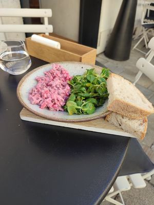 Very good salad with local root vegetables and homemade sourdough bread. The bread was so delicious it felt like I was biting into a cloud! Definitely recommending this place! at Fach Juice Shop in Bratislava