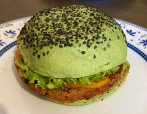 Jungle BBQ, with oat and red beans burger, tomatoes, salad, courgettes, vegan cheddar, bbq and wild sauces  at Flower Burger in Rome