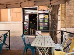 Seating area in front of restaurant at Flower Burger in Rome