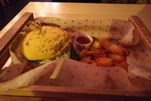 Cheesy Cecio burger with wedges at Flower Burger in Rome