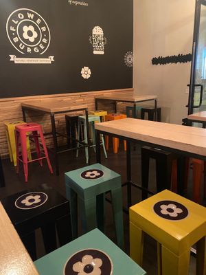 The decor is adorable and very Mary Quant  at Flower Burger in Rome