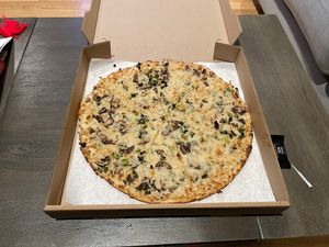 Mushroom pizza with vegan cheesecake  at Sliver Pizzeria  - Telegraph in Berkeley