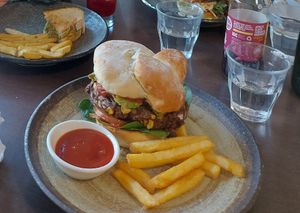 Mexican black bean burger (amazing). And a kids toastie with the smashed avocado chickpea 😊 at Laneway Cafe in Devonport