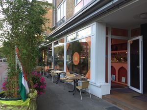Outdoor seating - unfortunately the street is quite busy  at Osho Ayuleela in Hamburg