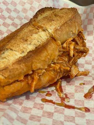 Lonche de No pierna de Yaca (jackfruit pulled pork sandwich style, with special Guadalajara sauce, special birote (bread).  at Chia Fonda Vegana in Guadalajara