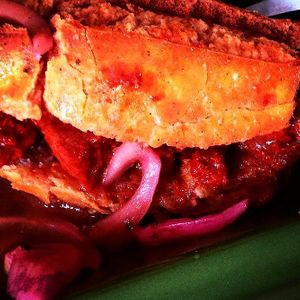 Torta ahogada, a special dish here in Jalisco, unique combination of salty bread, tomato sauce and soy steak stile meat. at Chia Fonda Vegana in Guadalajara
