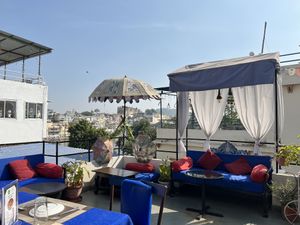 Seating area on the lower level   at Yummy Yoga Cafe in Udaipur
