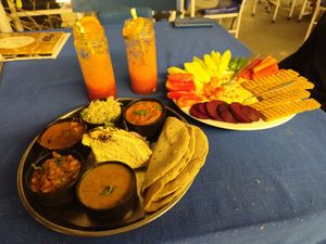 Full Vegan Thali, Orange and Strawberry juice, Hummus (awesome) with fresh Veggies ☺️ at Yummy Yoga Cafe in Udaipur