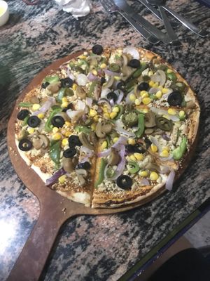 Vegan pizza (cashew crumble cheese) at Yummy Yoga Cafe in Udaipur