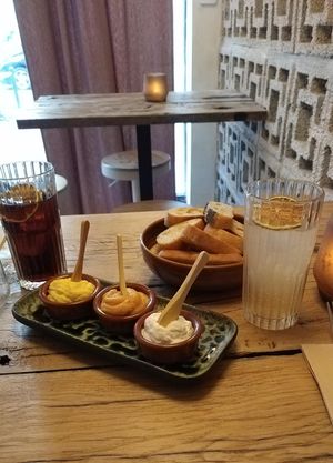 Starter: bread and dips curry mayo, kimchi hummus, aioli. at Hearth  in Amsterdam
