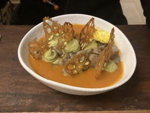 Aubergine rice Flour gnocchi over Sichuan cannellini bone en tomatensaus, bosui cashewkaas, lotus chips - 7.5/10  at Hearth  in Amsterdam