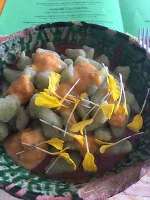 Handmade guacamole gnocchi with tomato & black bean sauce and corn dots  at Hearth  in Amsterdam