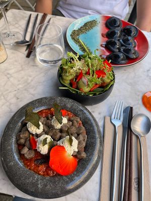 Buckwheat lentil gnocci, black charcoal ravioli & mixed salad at Hearth  in Amsterdam