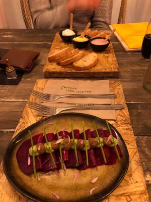 Rawvioli (beetroot) breads and dips in the background  at Hearth  in Amsterdam