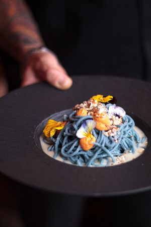 Blue Spirulina Tagliolini with Lemon-Almond Sauce and Bell Pepper Cashew Cheese at Hearth  in Amsterdam