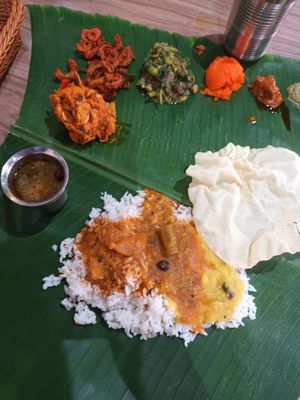 Banana leaf rice set with papadom and rasem by the side too at Bindhu Restaurant in Subang Jaya