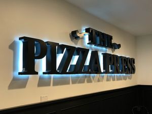 Sign inside at The Pizza Press in Anaheim