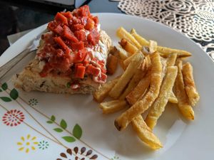 The facon pieces on the hot dog were the best! at El Maple in Quito