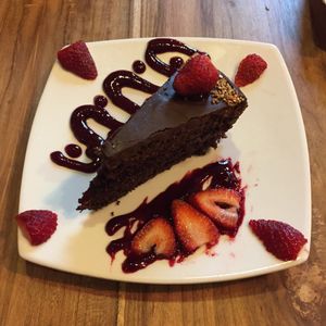 Vegan chocolate cake with strawberries at El Maple in Quito
