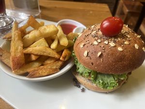 El Maple veggie burger with mushrooms, vegan cheese and avocado  on 7 grain bread   at El Maple in Quito