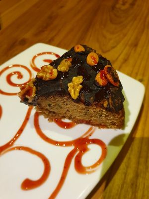 Carrot & nut cake which was served heated & was delicious! at El Maple in Quito