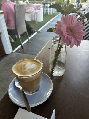 Delicious oat milk latte. Great service - they brought me flowers!  at Ozmosis in Edge Hill