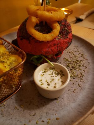 Beetroot bread burger (burger made of black beans and lentils) with veggie mayonnaise at Outro Lado in Faro