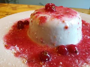 Panna cotta with berries. at Outro Lado in Faro